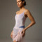 Dancer wearing a blue-grey Bodile Mika mesh ballet skirt with gathered ruching and a left-side split over a long-sleeve leotard.