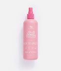A pink spray bottle of Knot Chance Strawberry Hair Detangler on a clean white background.