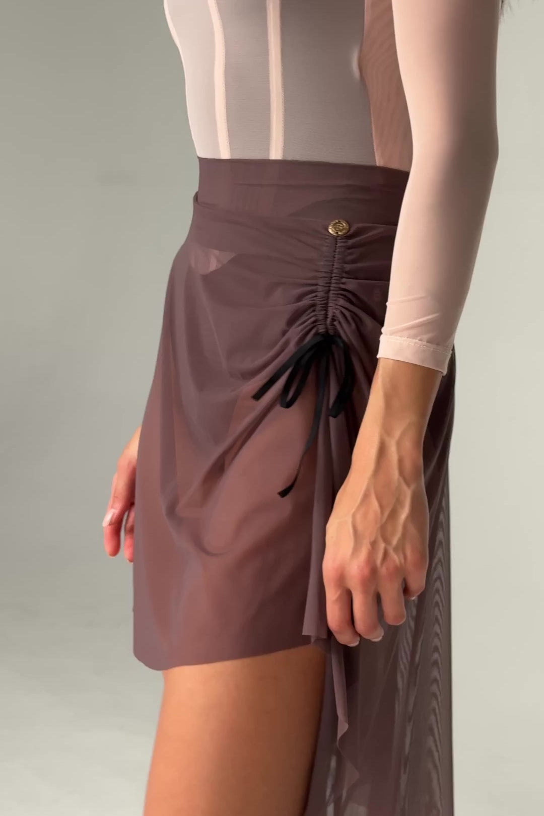 Vide of Bodile Gisella rehearsal skirt in smoky plum, showing ribbon ruching and a sheer asymmetric hem.