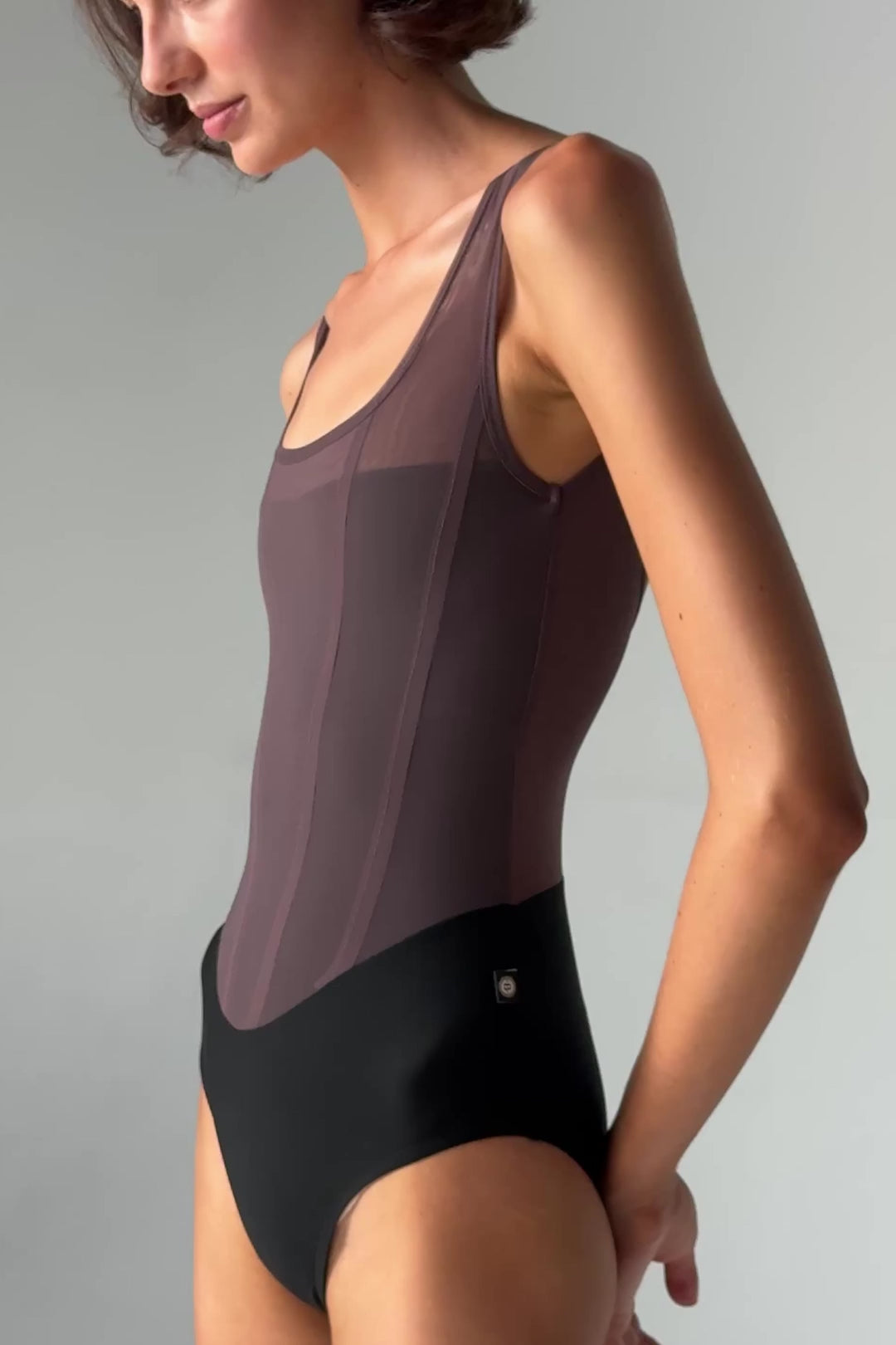 Video of Bodile Sofia Twilight Obsidian tank ballet leotard with a black lower body, smoky plum mesh and corset-style panel lines.