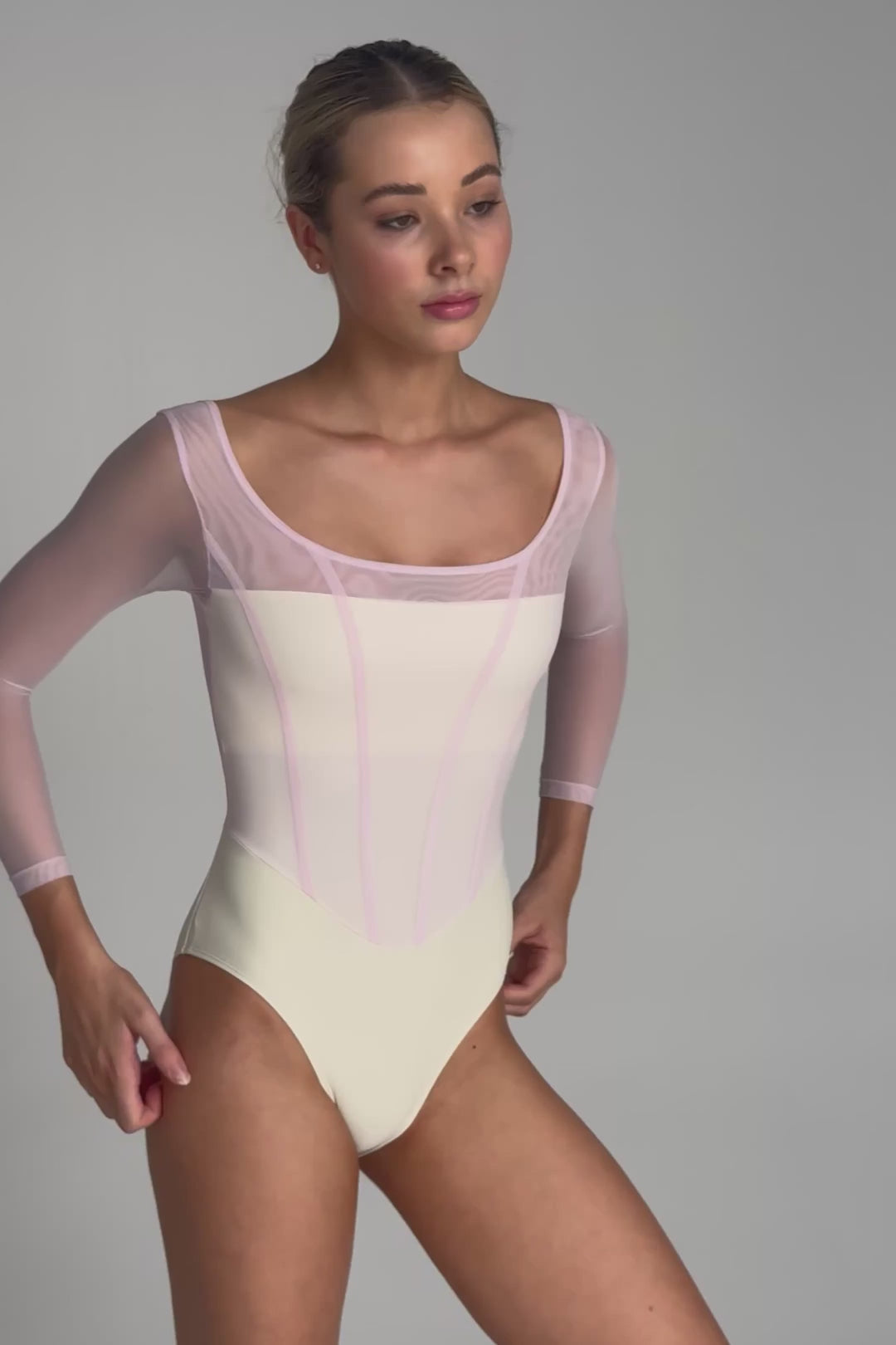 Video of Bodile Sofia Parfait Marshmallow long sleeve ballet leotard with pale blush mesh, a creamy body and corset-style seams.