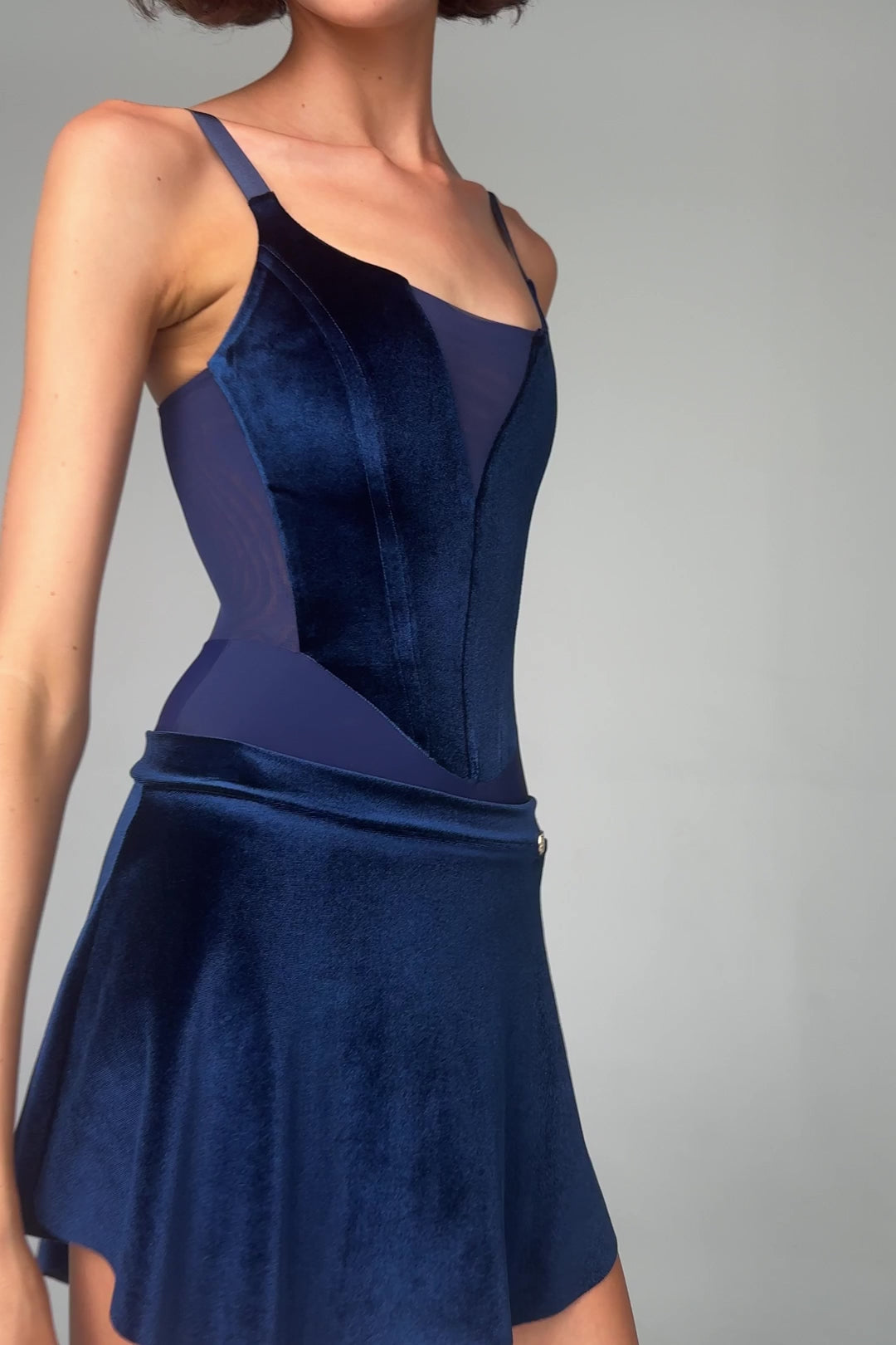 Video of the Bodile Zara velvet ballet skirt in navy, showing its raised side hem.