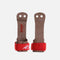 Front and back of Reisport Universal Junior gymnastics grips with two finger holes, a small dowel and red wrist straps