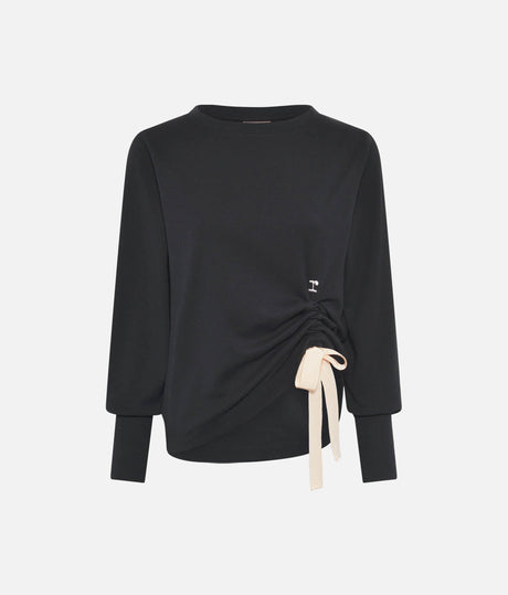 Front view of Repetto S0797 black sweatshirt laid flat, with fitted cuffs, side ruching, pale ribbon bow and small r logo.