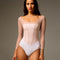 Front of Bodile Sofia Frost Nougat long sleeve ballet leotard with a white body, soft pink mesh overlay and corset-style seams.