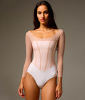 Front of Bodile Sofia Frost Nougat long sleeve ballet leotard with a white body, soft pink mesh overlay and corset-style seams.