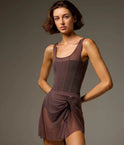 Bodile Sofia Twilight Obsidian tank leotard styled with a separate plum-toned ruched mesh skirt and black ribbon tie.