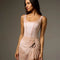 Bodile Sofia Nougat Frost tank leotard styled with a separate short blush mesh skirt featuring ruching and a black ribbon tie.