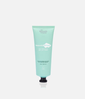 The Smooth Company Smooth Dream 11-in-1 styling cream in a mint-green squeeze tube with a black cap.