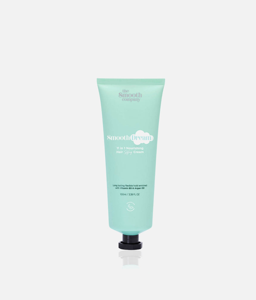 The Smooth Company Smooth Dream 11-in-1 styling cream in a mint-green squeeze tube with a black cap.
