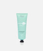 The Smooth Company Smooth Dream 11-in-1 styling cream in a mint-green squeeze tube with a black cap.