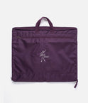 Tendu T1027 garment bag in aubergine, folded for carrying with twin handles, a front zip pocket and ballerina logo.