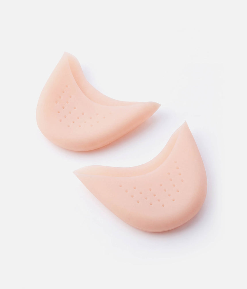 Pair of pale pink Tendu Soft Gel Toe Pads showing their curved shape, perforated underside and longer upper section.