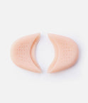 Two Tendu Soft Gel Toe Pads with their openings facing each other and the perforated surfaces visible.