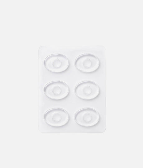 Six clear Tendu Hot Spot Dots arranged in two columns on a backing sheet, showing their ring-shaped design.