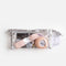 Tendu Dancer’s Sewing Kit in a clear zipped pouch with silver trim, showing pink ribbon, darning thread and sewing tools inside.