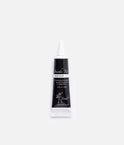 Front of a Tendu Suede Tip Shoe Glue tube with a black label, white screw cap and ballerina logo on a white background.