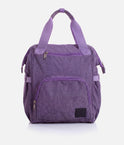Front and back views of the Tendu Smart Bag T1062 in Lavender, showing zip pockets, carry handles and backpack straps.