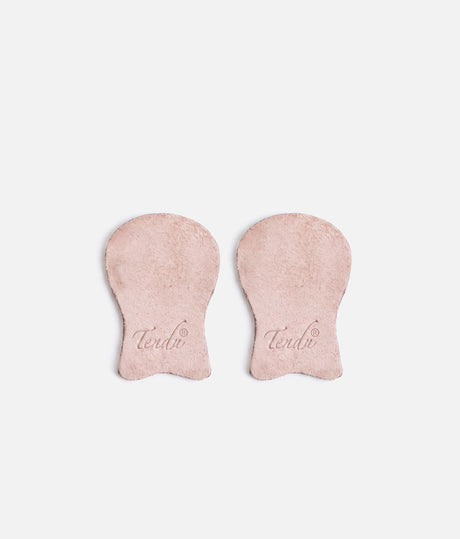 Pair of pale suede Tendu pointe shoe tips laid side by side, showing rounded platform sections, narrower lower tabs and printed Tendu logos.