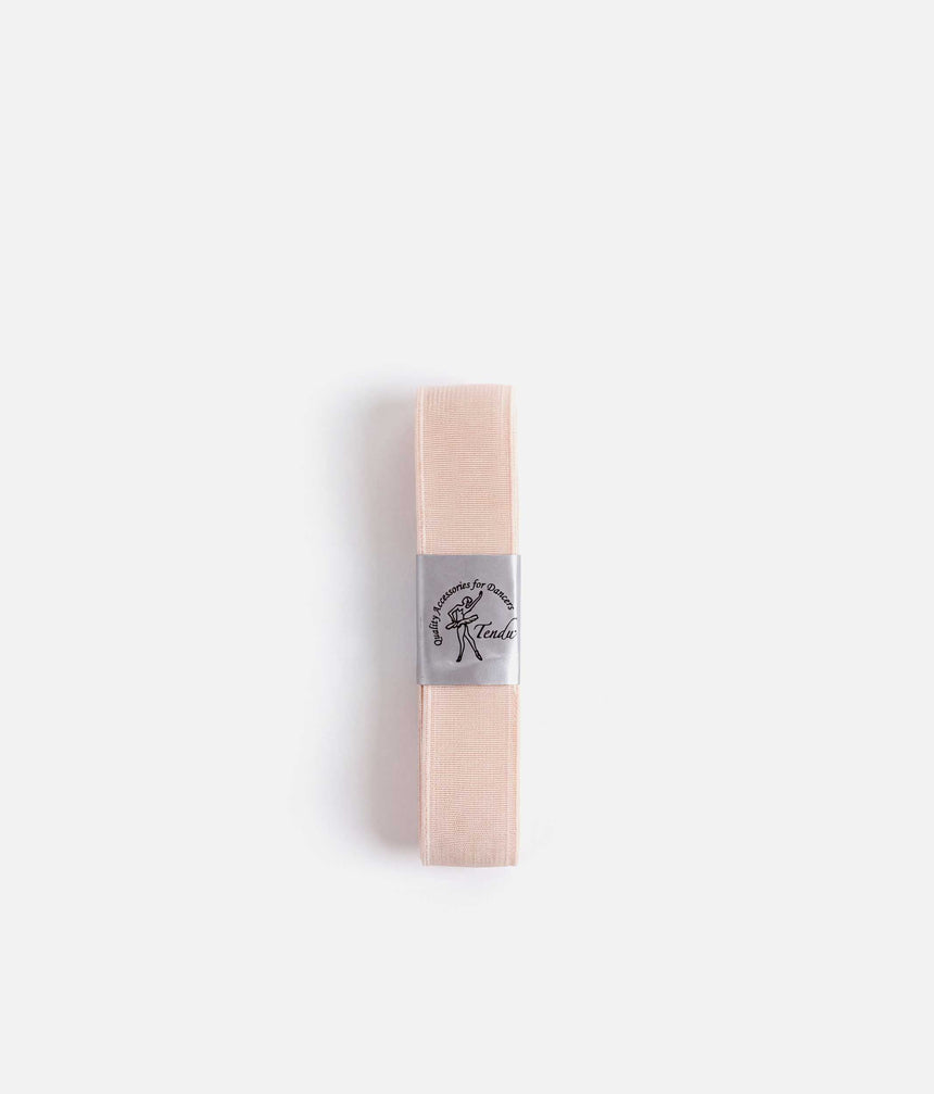 Flat view of pale pink Tendu thick pointe shoe elastic showing its solid textured surface and silver branded band.