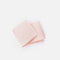 Pale pink Tendu vamp elastic folded on a white background, showing its wide shape and fine textured surface.