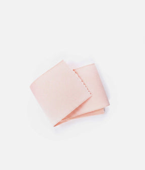 Pale pink Tendu vamp elastic folded on a white background, showing its wide shape and fine textured surface.