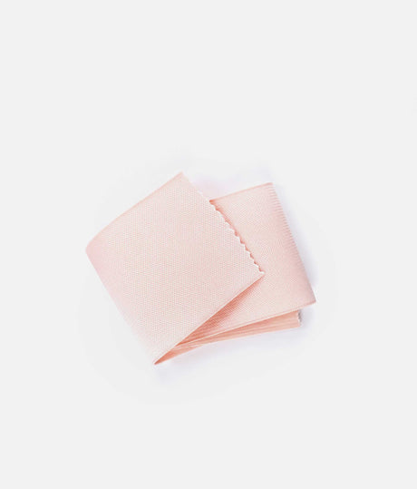Pale pink Tendu vamp elastic folded on a white background, showing its wide shape and fine textured surface.