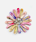 A collection of ballet flats arranged in a circular pattern on a white background, each attached to a silver key ring. The shoes feature a variety of pastel colors including pink, purple, blue, yellow, and orange, with gold floral details on the insoles.