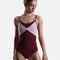 Dancer wearing the YUMIKO Kathy Burgundy ballet leotard, showing its bow-like Rose mesh front and high-cut leg.