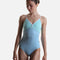 Dancer wearing YUMIKO Daria in Pool and Frozen with White trim, a shaped V-front and a high-cut ballet leg.