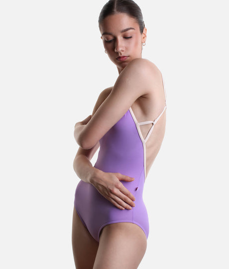Side view of YUMIKO Tamara Iris leotard showing the low open back and fine geometric strap connections in Misty Rose.