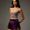 Front view of the Bodile Zara velvet ballet skirt in deep purple, with a smooth waistband and curved hem.