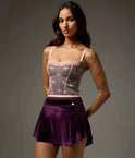 Front view of the Bodile Zara velvet ballet skirt in deep purple, with a smooth waistband and curved hem.