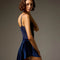 Side and back view of the Bodile Zara velvet ballet skirt in navy, showing its raised side hem.